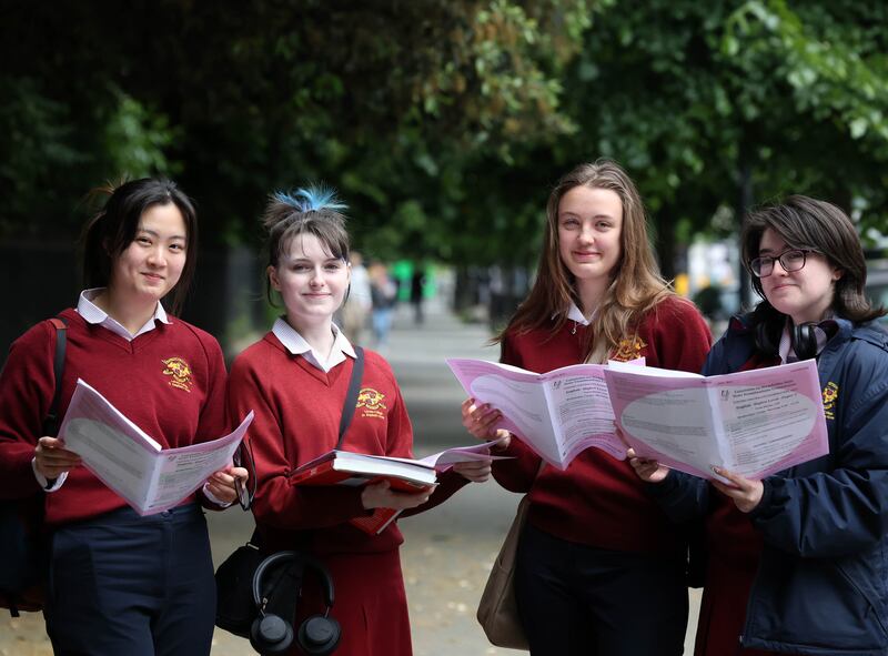 Loretto College students, Jessica Jiang, Carenza Oman, Joanna Bulynko and Mya O'Gorman-Bather pictured looking at the Leaving Cert English paper one after finishing the first exam. Photograph: Sam Boal/Rollingnews.ie