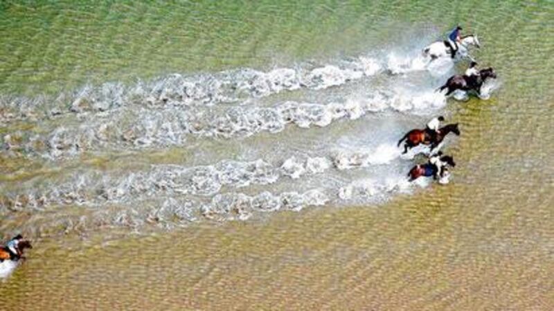 TAKING THE PLUNGE Riding through the sea in Co Mayo