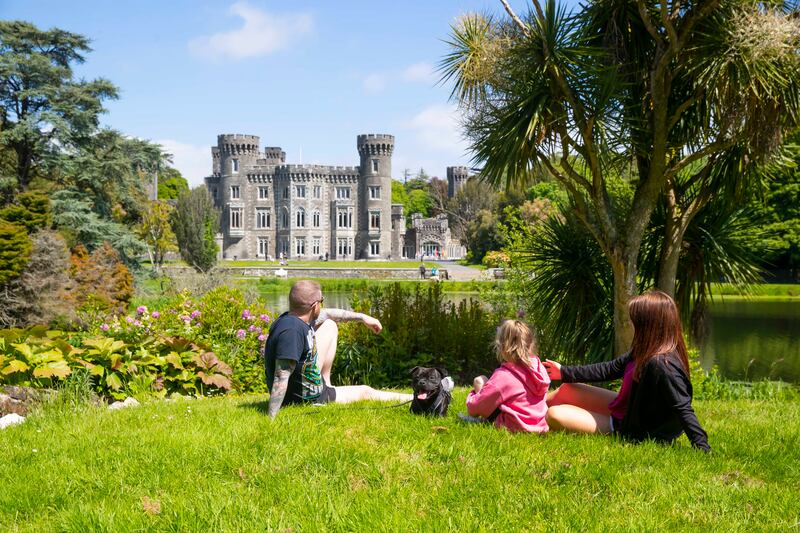 Glenn and Freya Devitt and Lauren Harte from Dublin enjoying the sunshine at Johnstown Castle estate.