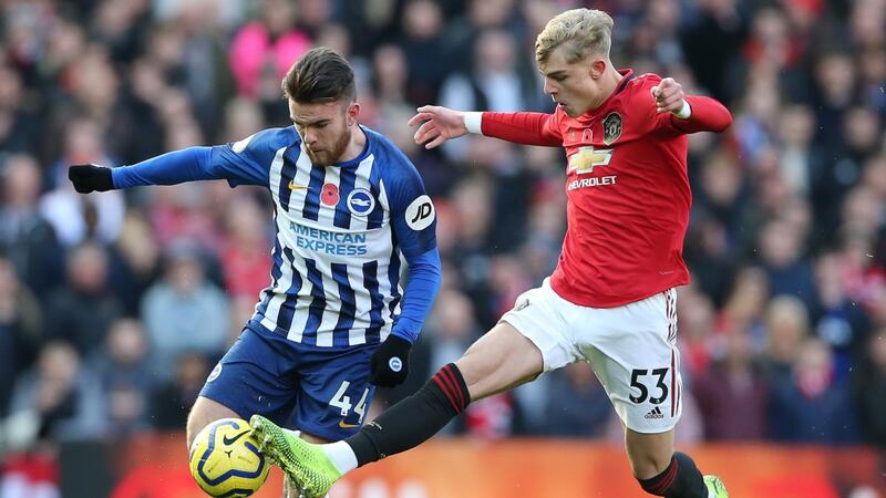 Brandon Williams tackles Ireland’s Aaron Connolly during Manchester united’s win over Brighton. Photograph: Nigel Roddis/EPA