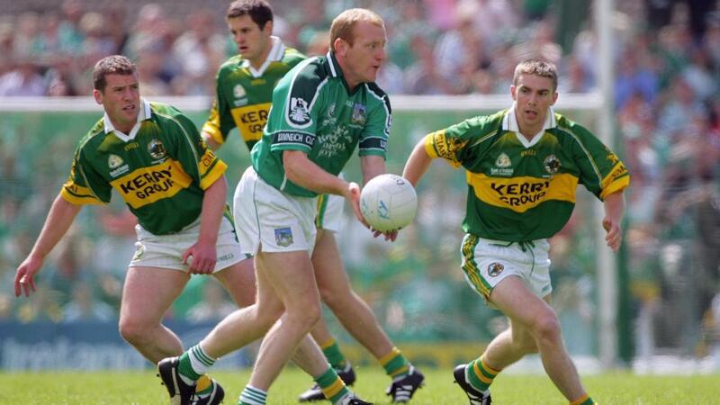 Limerick’s John Quane takes Kerry on Munster football final replay Kin 2004. Photograph: Inpho.