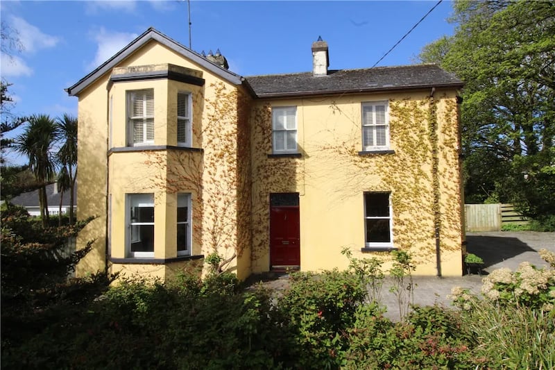 The house sits on an acre of mature gardens, including fruits and a herb garden