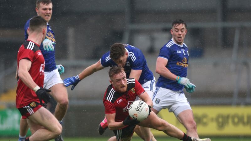 Cavan’s Ciaran Brady tackles Down’s Liam Kerr during his side’s Ulster semi-final win. Photograph: Matt Mackey/Inpho