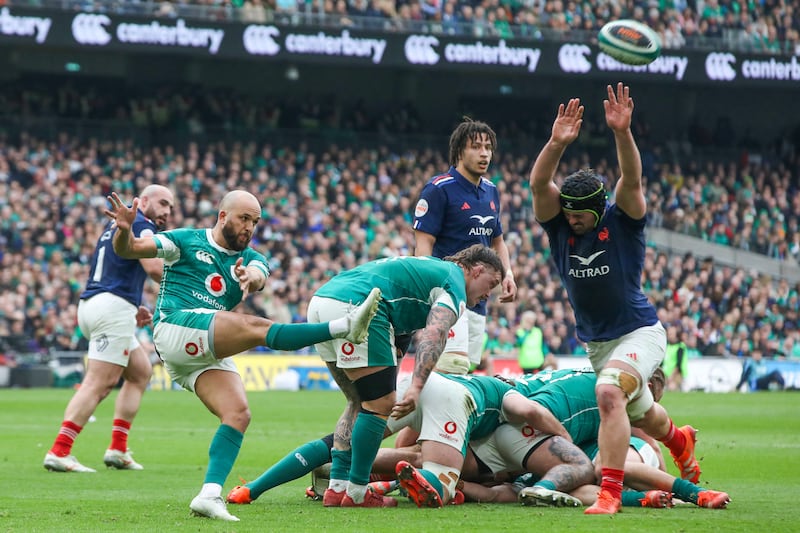 France's Gregory Alldritt attempts to charge down a kick from Jamison Gibson-Park during the Six Nations game at the Aviva Stadium. Photograph: Psul Faith/AFP         