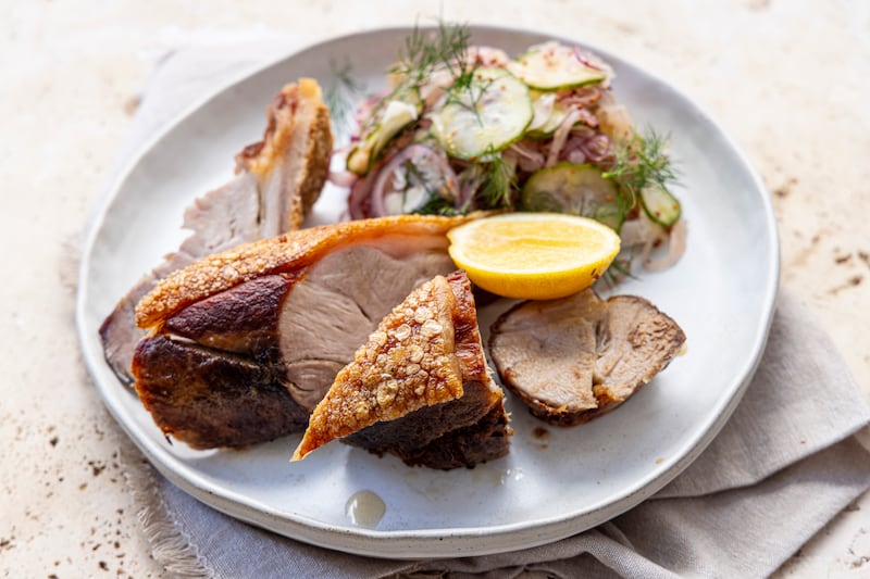 Crispy-skinned pork shoulder wedge with sauerkraut slaw. Photograph: Harry Weir