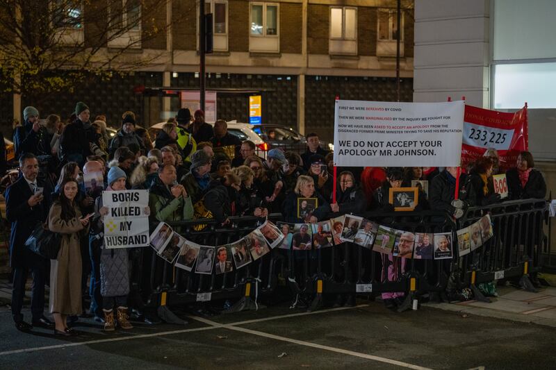 Protesters gather as Boris Johnson gives evidence at the Covid inquiry in London. Photograph: Carl Court/Getty Images