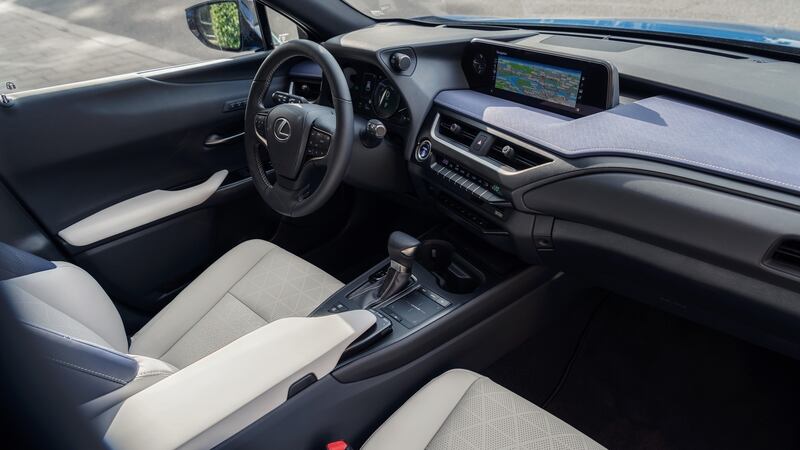 The UX’s cabin is compact, wrapping around the driver in the way one would expect of a coupé rather than an SUV.