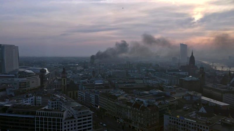 Smoke engulfs the city skyline during a protest of members of ‘Blockupy’ anti-capitalist movement.  Photograph: Reuters