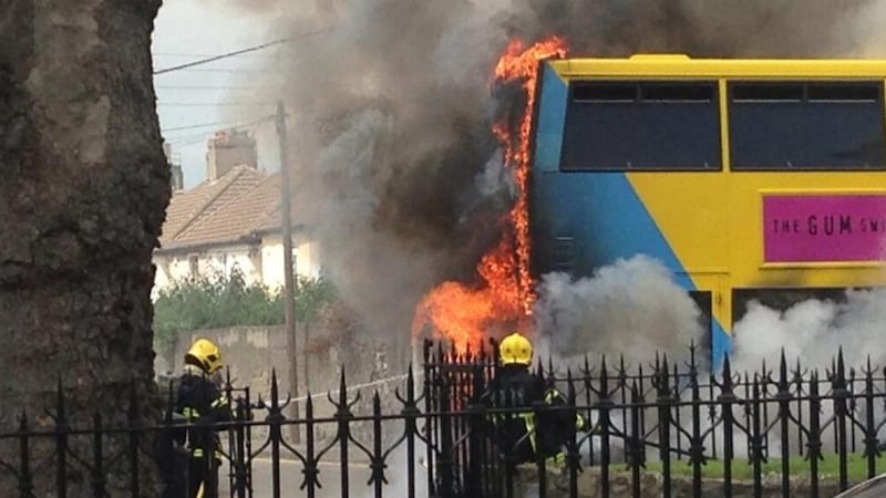 Firefighters at the scene of a burning Dublin Bus vehicle on the Harold’s Cross Rd in Dublin this afternoon. Photograph: @Psycrow via Twitter