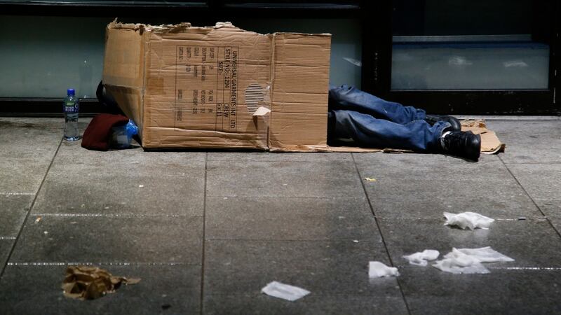 A man sleeps in a cardboard box  on Marlborough Street in Dublin. Photograph: Nick Bradshaw/The Irish Times