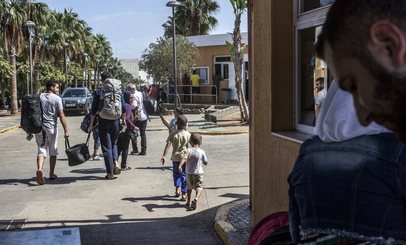 Syrians migrants enter a temporary centre for immigrants and asylum seekers in the Spanish enclave of Melilla. Photograph: José Colon/AFP/Getty Images