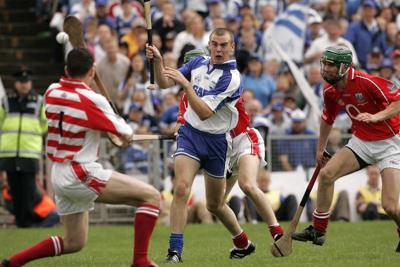 Eoin Kelly, fires the sliotar past Cork goalkeeper Donal Óg Cusack in the 2004 Munster Senior Hurling Final. Photograph: Dara Mac Dónaill