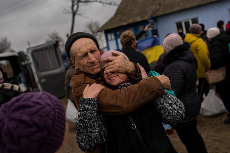 Ukrainian family members reunite after Russian troops withdrew from the Kherson region. Photograph: Bernat Armangue/AP/PA