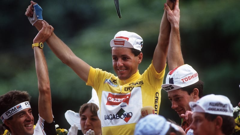 Roche celebrates winning the Tour de France in 1987, when he became only the second rider to win the tour, Giro d’Italia and World Championships in the same season, after the Belgian Eddy Merckx. Photograph: Getty Images