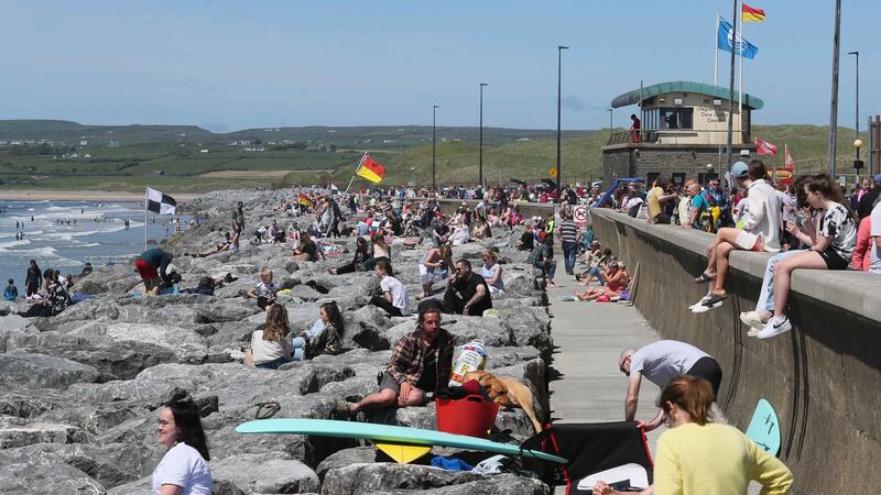 People enjoying the sunshine at Lahinch, Co Clare, on Sunday. Photograph: Eamon Ward