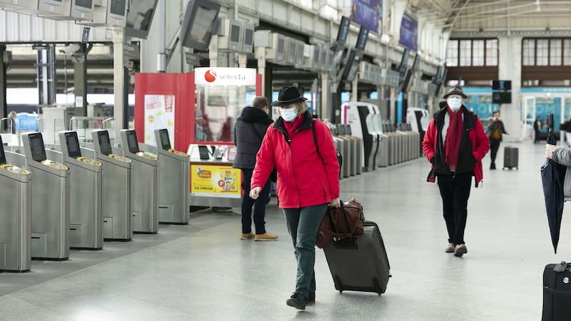 Travelers wear face masks after in Paris at Gare de Lyon railway station. Photograph: Laura Stevens/Bloomberg.