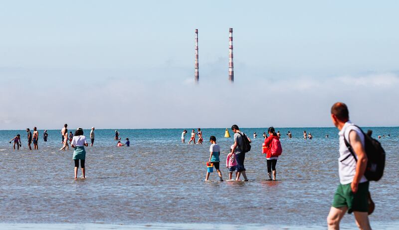 People swim in the sea during good weather at Seapoint beach in South Dublin on Sunday. Photograph: PA  