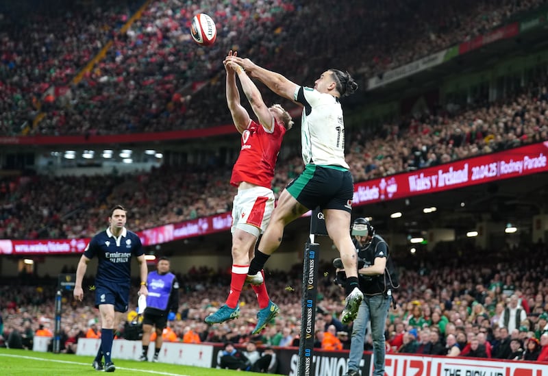 James Lowe palms the ball back for Jamie Osborne's try during the Six Nations match against Wales at the Principality Stadium. Photograph: David Davies/PA Wire