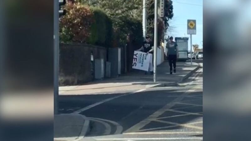 A screengrab from a video provided by Labour TD Jan O’Sullivan purporting to show her party’s posters for the abortion referendum being removed.