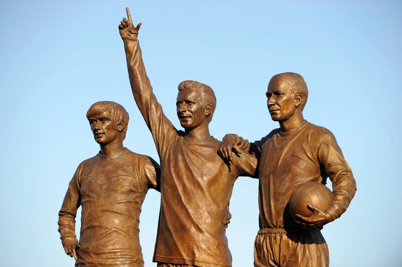 The statue of Manchester United's 'holy trinity' – George Best, Denis Law and Bobby Charlton – outside Old Trafford Stadium. Photograph: AMA/Corbis via Getty Images