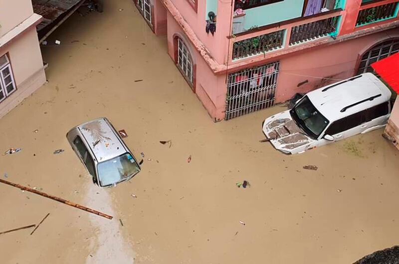 Cars submerged in water after flash floods swamped towns in Sikkim, India. Photograph: Prakash Adhikari/AP/PA