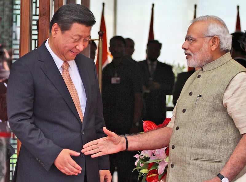 Indian prime minister Narendra Modi welcomes Chinese president Xi Jinping back in 2014. Photograph: AP