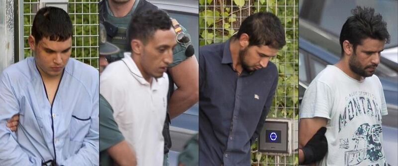 From left: Mohamed Houli Chemlal, Driss Oukabir, Salah El Karib, Mohamed Aallaa are escorted from a detention center on Tuesday before being tranferred to the National Court. Photograph: Getty Images