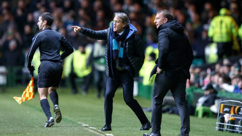 Roberto Mancini of FC Zenit and Brendan Rodgers give instructions from the sideline at Celtic Park. Photograph: PA