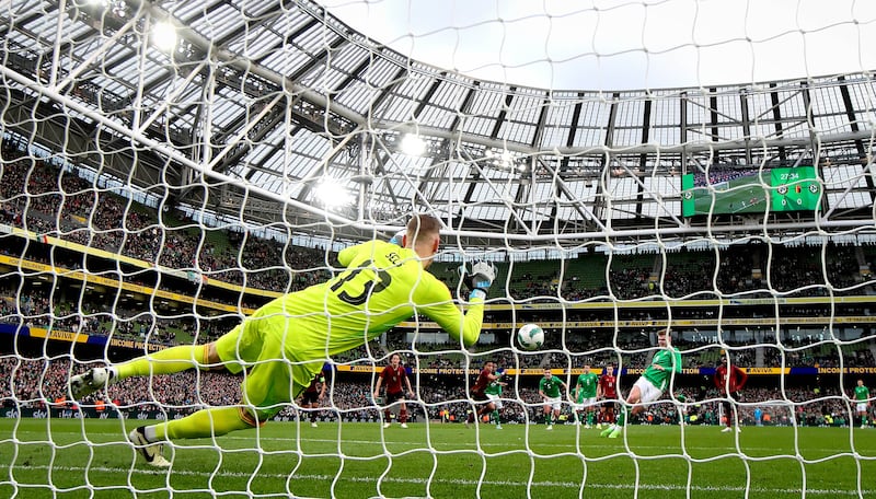 Belgium goalkeeper Matz Sels saves a penalty by Evan Ferguson. Photograph: Ryan Byrne/Inpho
