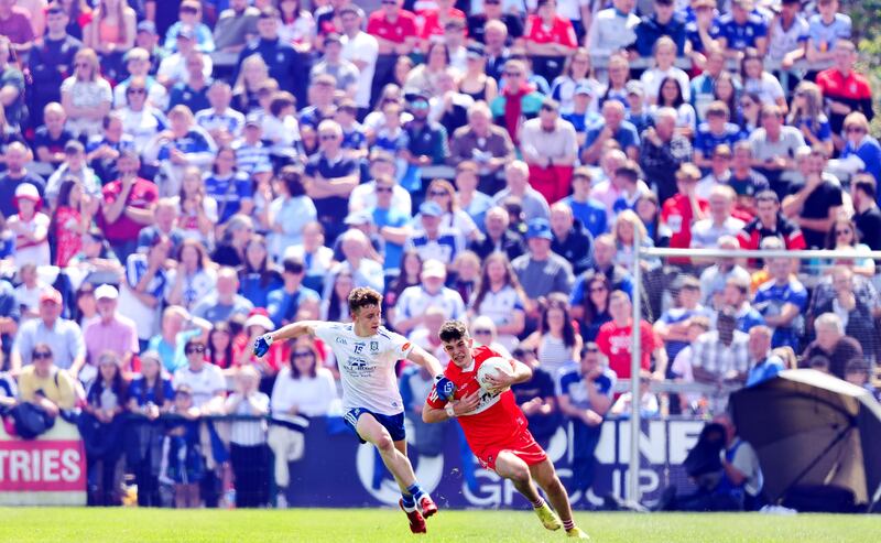 Monaghan's Luke McKenna tackles Johnny McGuckian of Derry at the Athletic Grounds. Photograph: Tom Maher/Inpho