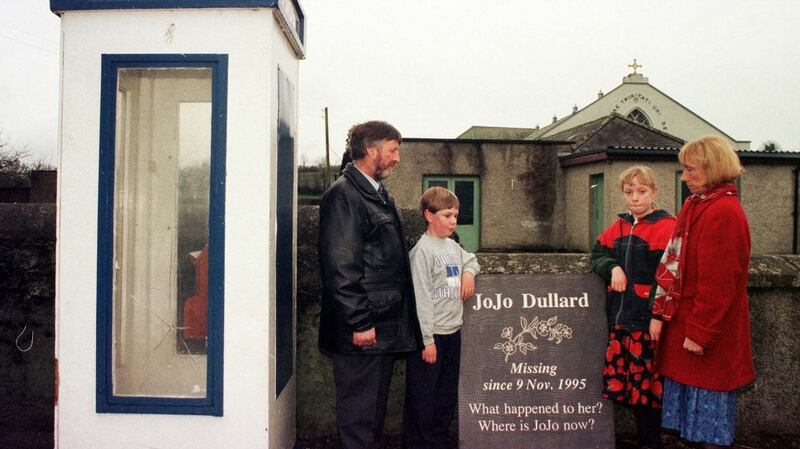 Jo Jo Dullard’s sister Mary Phelan, right, with her husband Martin and their children with the memorial stone besides the phone box that Jo Jo made her last call from. Photograph: John Cogill