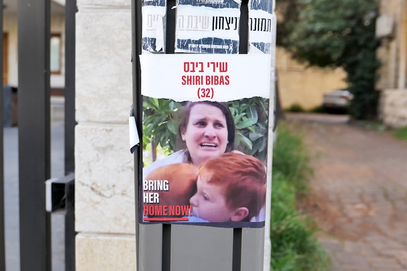 A poster showing Israeli hostage Shiri Bibas with her two children on the day they were taken captive in the Hamas-led raid on Israel. Photograph: Abir Sultan/EPA