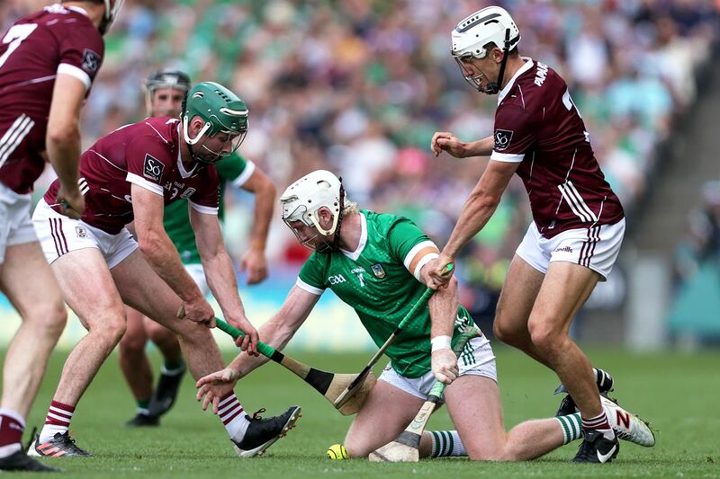 Limerick's Cian Lynch with Cathal Mannion and Daithi Burke of Galway.
Photograph: Laszlo Geczo/Inpho