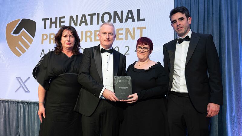 Gary Mander, awards judging coordinator, presents the procurement leader of the year to Jeanne Copeland, Lionel McCarthy Junior and Elizabeth-Sarah McCarthy on behalf of Lionel McCarthy.