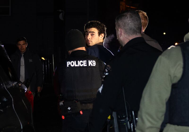 Luigi Mangione is escorted by police to his arraignment at the Blair County Courthouse in Pennsylvania on Monday night. Photograph: Rachel Wisniewski/The New York Times