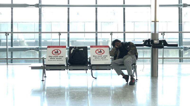 Signs asking people to not use seats in Terminal 5 at Heathrow Airport in London on Wednesday. The airport expects 90 per cent fewer passengers compared to April last year, as governments continue to advise against non-essential travel due to the Covid-19 outbreak. Photograph: Richard Heathcote/Getty Images