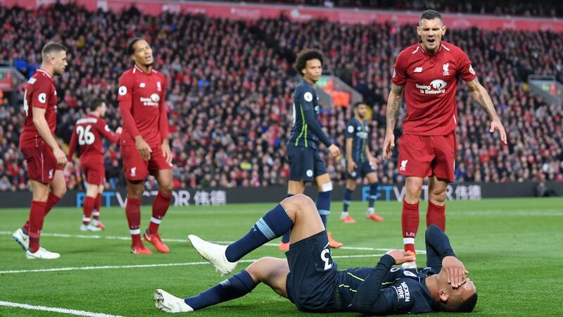 Gabriel Jesus reacts after being tackled by Lovren. Photo: Laurence Griffiths/Getty Images