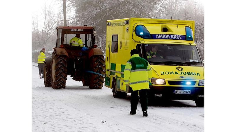 CARLOW Pulling an ambulance after it got stuck in Hacketstown. Photograph: Michael Kelly