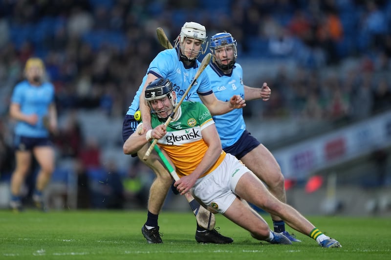 Offaly's Dan Ravenhill is tackled by Dublin's David Lucey. Photograph: James Lawlor/Inpho