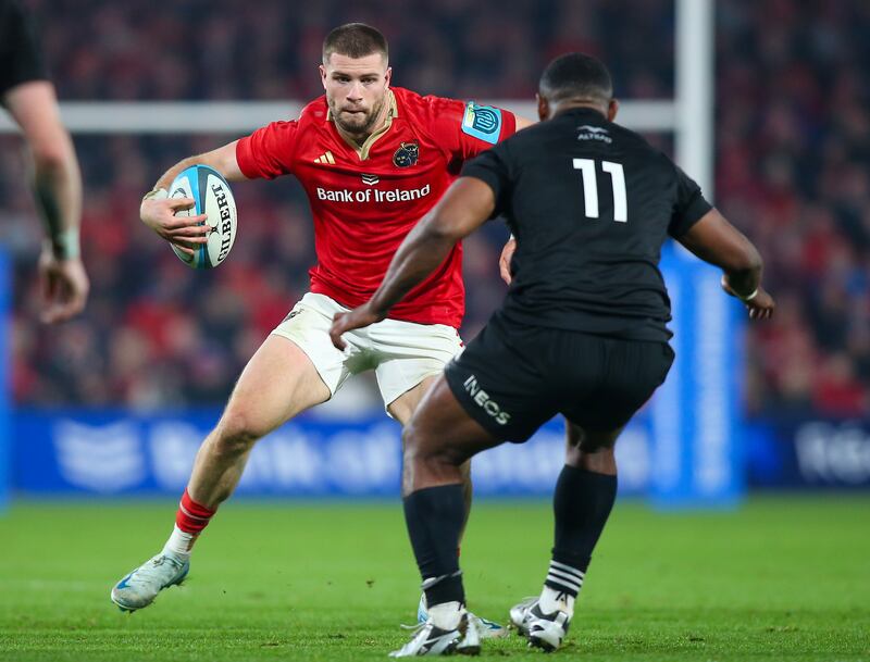 Munster's Diarmuid Kilgallen  in action against Kini Naholo of the All Blacks XV during the game at Thomond Park. Photograph: Ken Sutton/Inpho