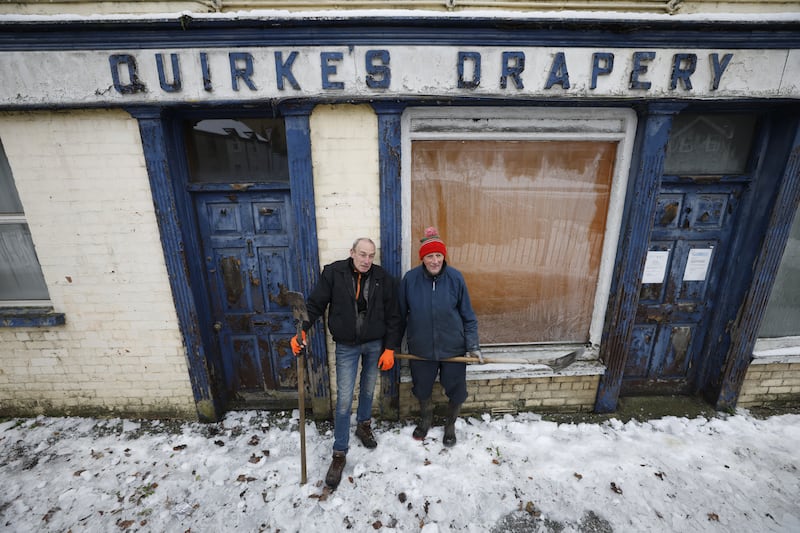 Kevin Maher and former Tipperary hurler Pat Fitzell help clear the icy pavements in Cahsel. Photograph: Nick Bradshaw/The Irish Time