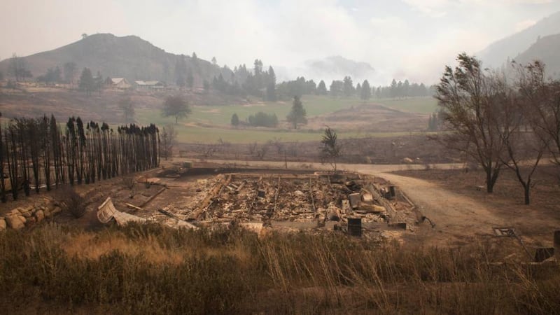 Debris from a burnt structure is pictured near Alta Lake Golf Course after much of the surrounding area was consumed by the Carlton Complex Fire near Pateros, Washington. Photograph: David Ryder/Reuters.