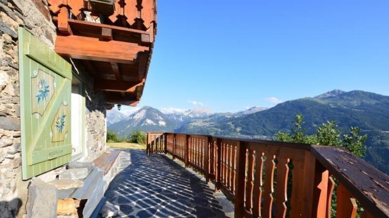 A chalet with a view of the Trois Vallées ski area in France.