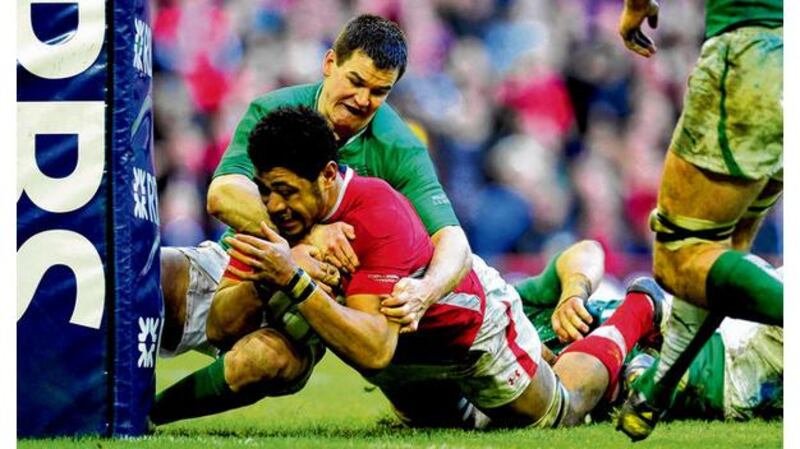 Jonathan Sexton prevents a certain score by Toby Faletau. Photograph: Inpho/Getty Images