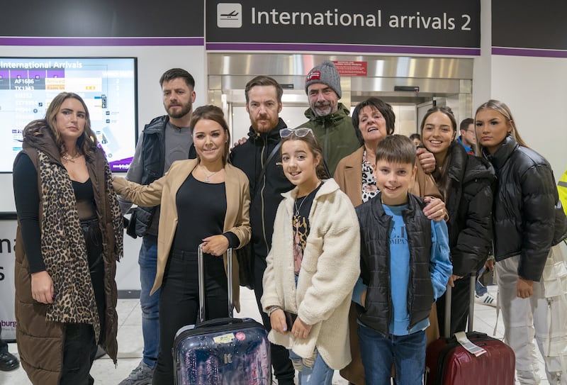 Scottish construction engineer Brian Glendinning with his wife Kimberly and family after arriving at Edinburgh airport following his release after two months in Iraqi jail. Photograph: Jane Barlow/PA