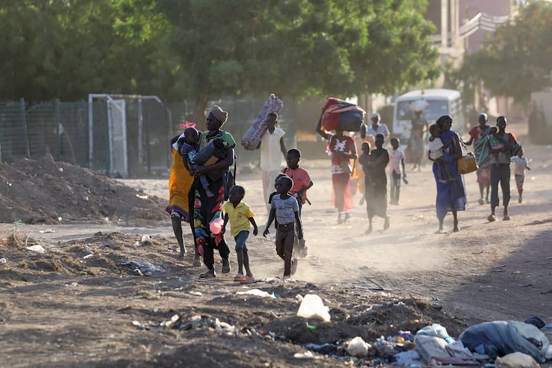 People flee their neighbourhoods amid fighting between the army and paramilitaries in Khartoum, Sudan, on Wednesday, following the collapse of a 24-hour truce. Photograph: AFP/Getty