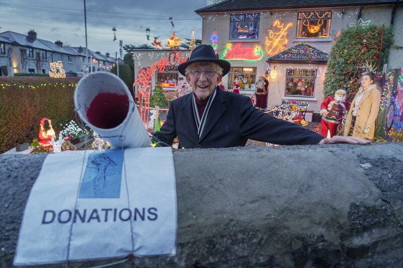 William Tilly and his granddaughter Hannah checking over their festive display. Photograph: Barry Cronin