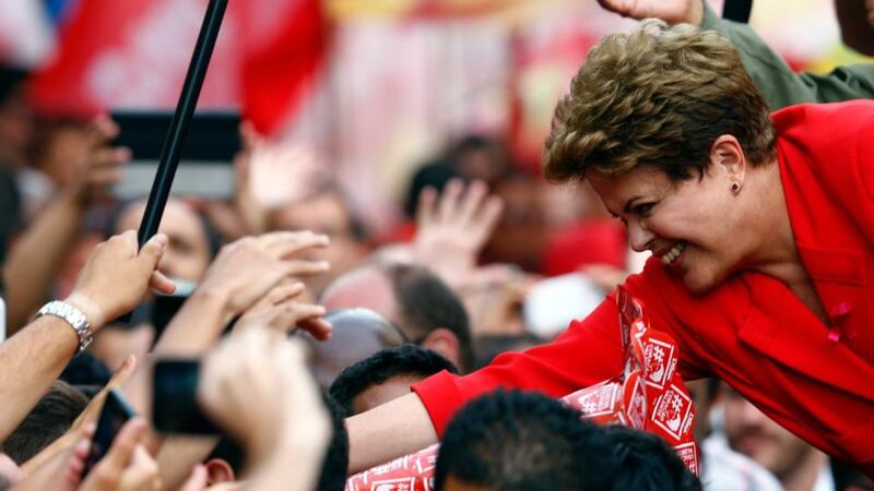 Brazil’s president and Workers’ Party (PT) presidential candidate Dilma Rousseff greets supporters  in Porto Alegre. Photograph: Paulo Whitaker/Reuters.