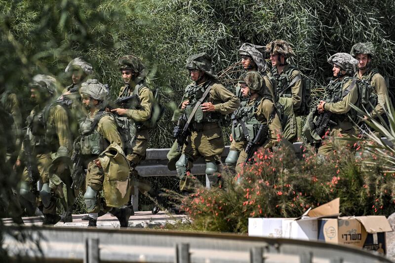 Israeli army soldiers at a checkpoint near the border with the Gaza Strip in Israel's southern city of Sderot. Photograph: Yuri Cortez/AFP via Getty Images