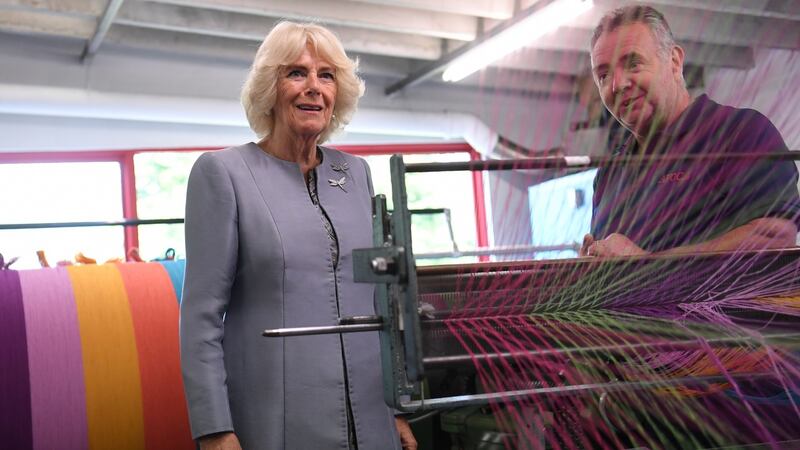 Camilla, Duchess of Cornwall is shown a loom as she visits the Avoca Mill in Co Wicklow. Photograph:  Neil Hall/Pool/Getty Images